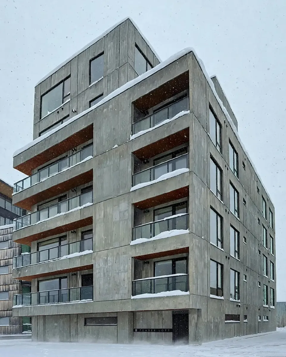 The completed concrete facade of Powder Loft in winter