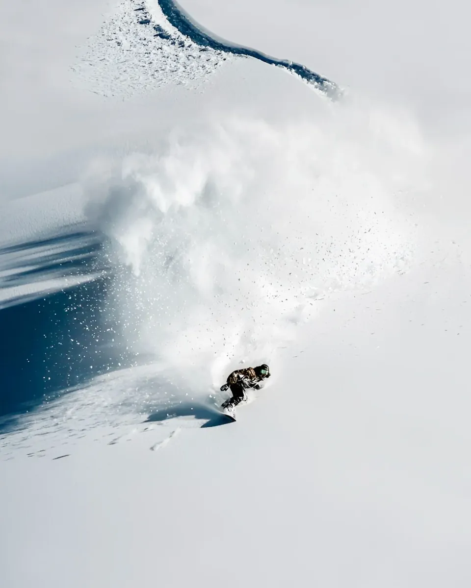 Skier in deep Niseko powder