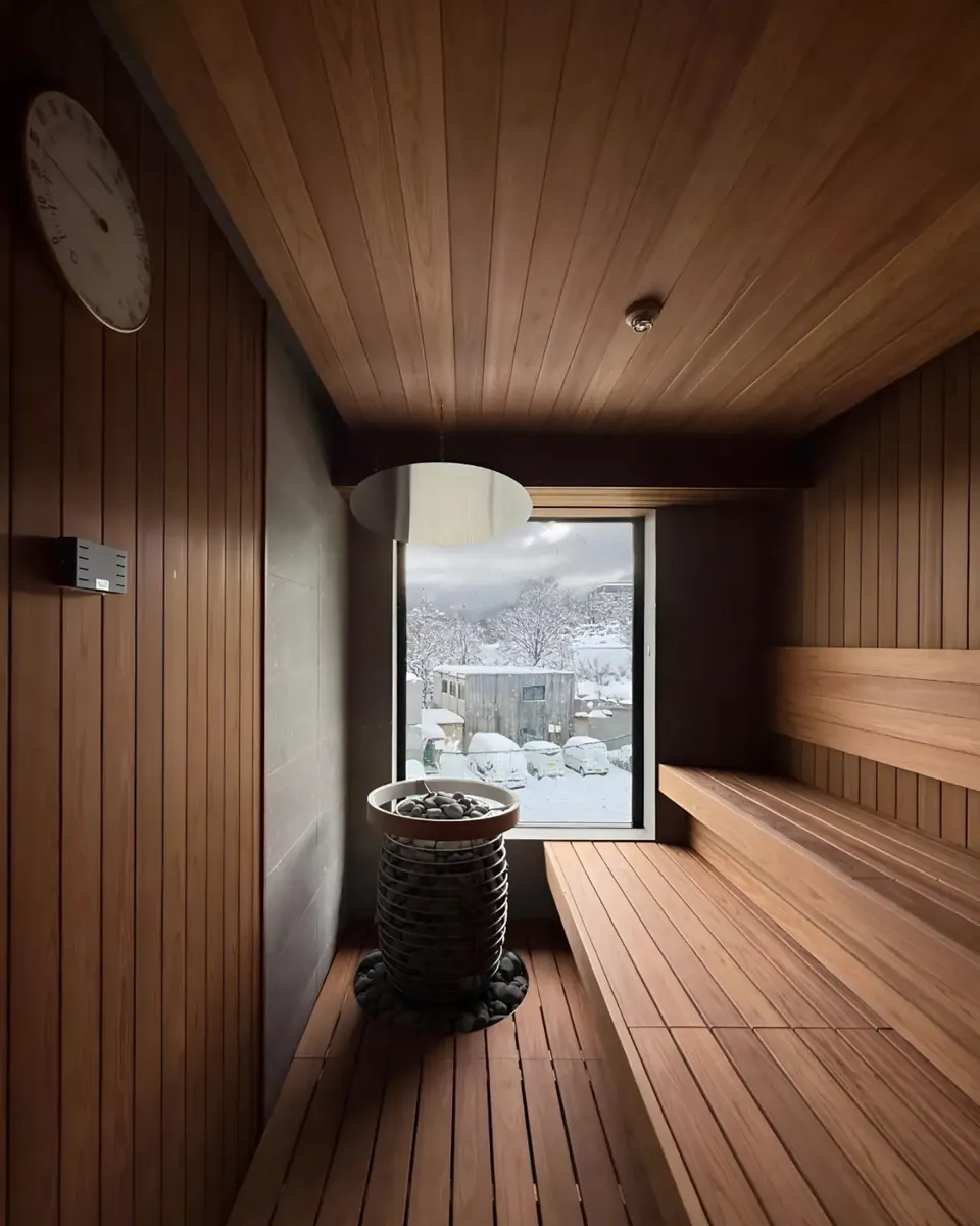 Private sauna with a window onto the snow