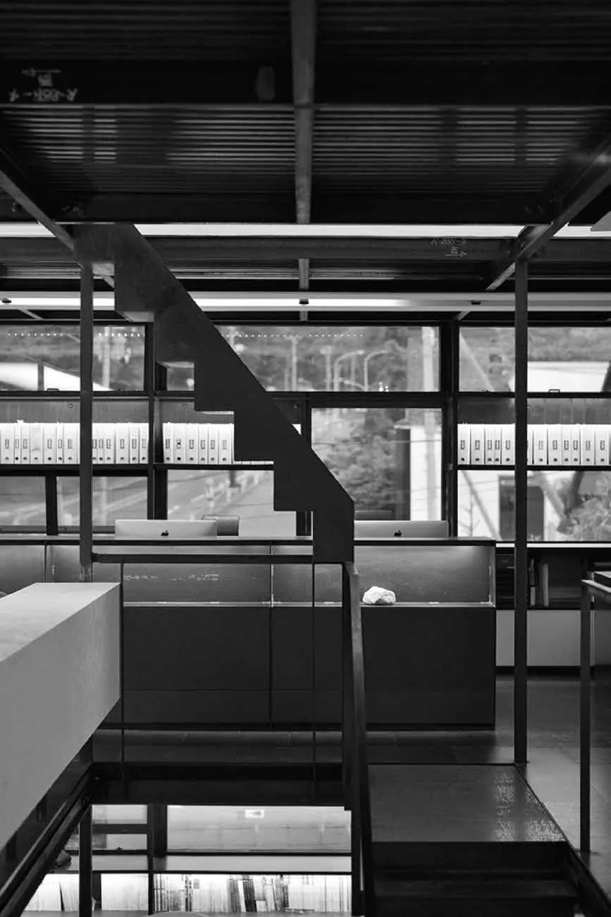 Steel staircase and shelving in an architect's studio
